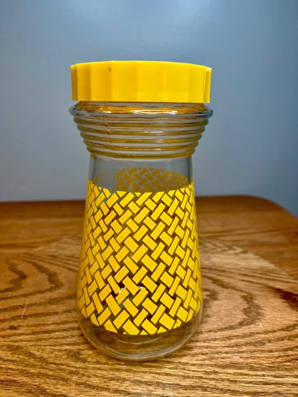 Vintage Folger's glass carafe with lid. Bright yellow basket weave design. Measu